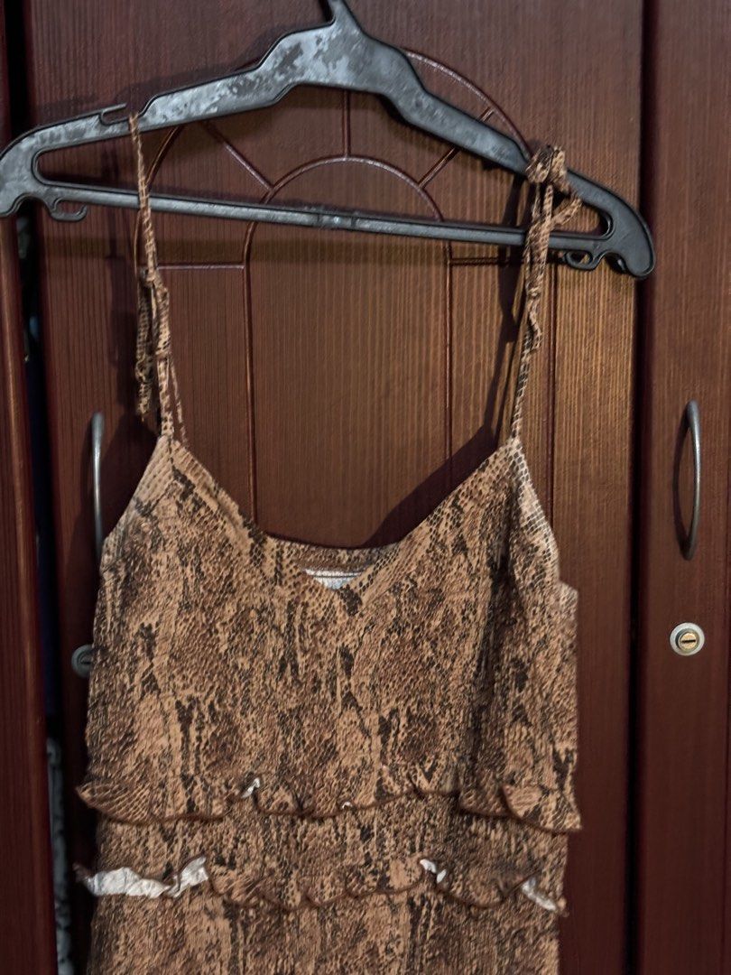 Express Snake Print Tiered Ruffle Mini Dress (Category: Dresses) located in Makati City. Submitted by clutterfairie (Listing ID 1447587897, Image 2). Description: - Up to XL Cute Express mini dress - Trendy snake print - Tiered, ruffled design for a playful look - Adjustable spaghetti straps for a perfect fit - Versatile for a night out or casual daytime wear.