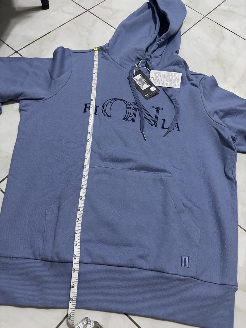 FILA BTS ON Hoodie Sweatshirt CTR Small (Category: Coats, Jackets and Outerwear) located in Muntinlupa City. Submitted by itsmiguel (Listing ID 1447627865, Image 1). Description: - Authentic FILA BTS ON Hoodie Sweatshirt (rare item) - Size: Small (S) - Color: Light Blue / Periwinkle - Features: FILA logo and 'BTS ON' graphic on front - Design: Drawstring hood, front pocket - Condition: Brand new with tags attached - Original Retail Price: P3,999.