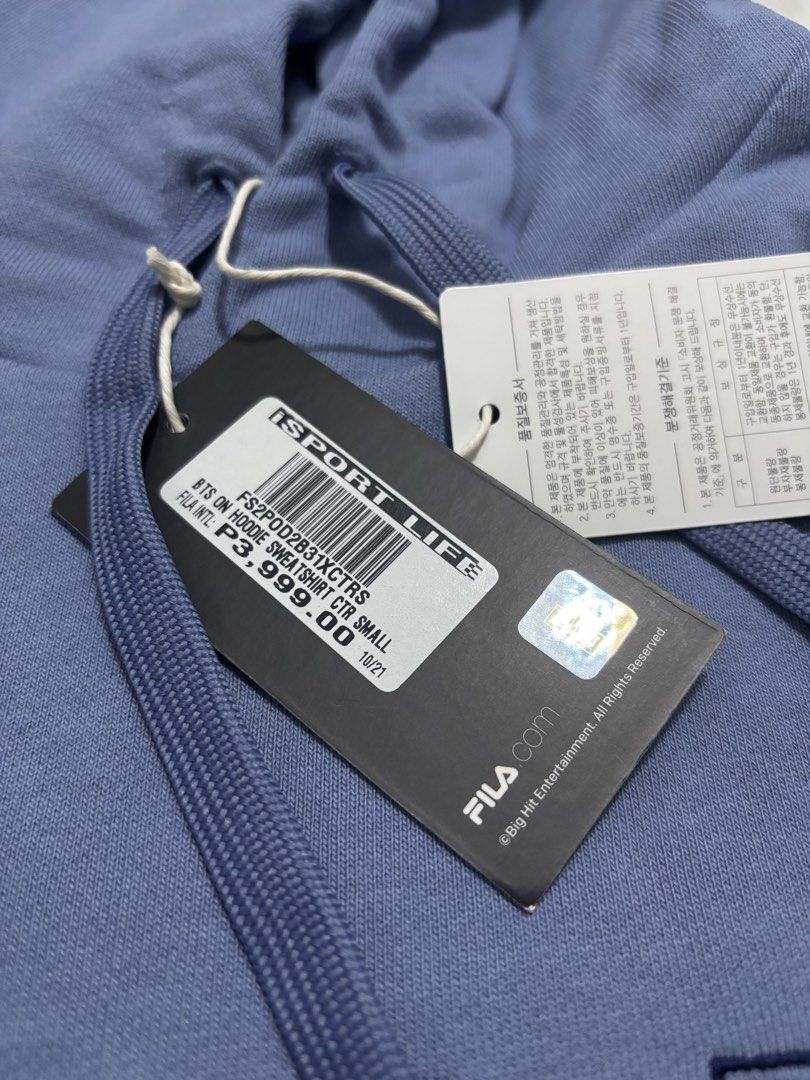 FILA BTS ON Hoodie Sweatshirt CTR Small (Category: Coats, Jackets and Outerwear) located in Muntinlupa City. Submitted by itsmiguel (Listing ID 1447627865, Image 3). Description: - Authentic FILA BTS ON Hoodie Sweatshirt (rare item) - Size: Small (S) - Color: Light Blue / Periwinkle - Features: FILA logo and 'BTS ON' graphic on front - Design: Drawstring hood, front pocket - Condition: Brand new with tags attached - Original Retail Price: P3,999.