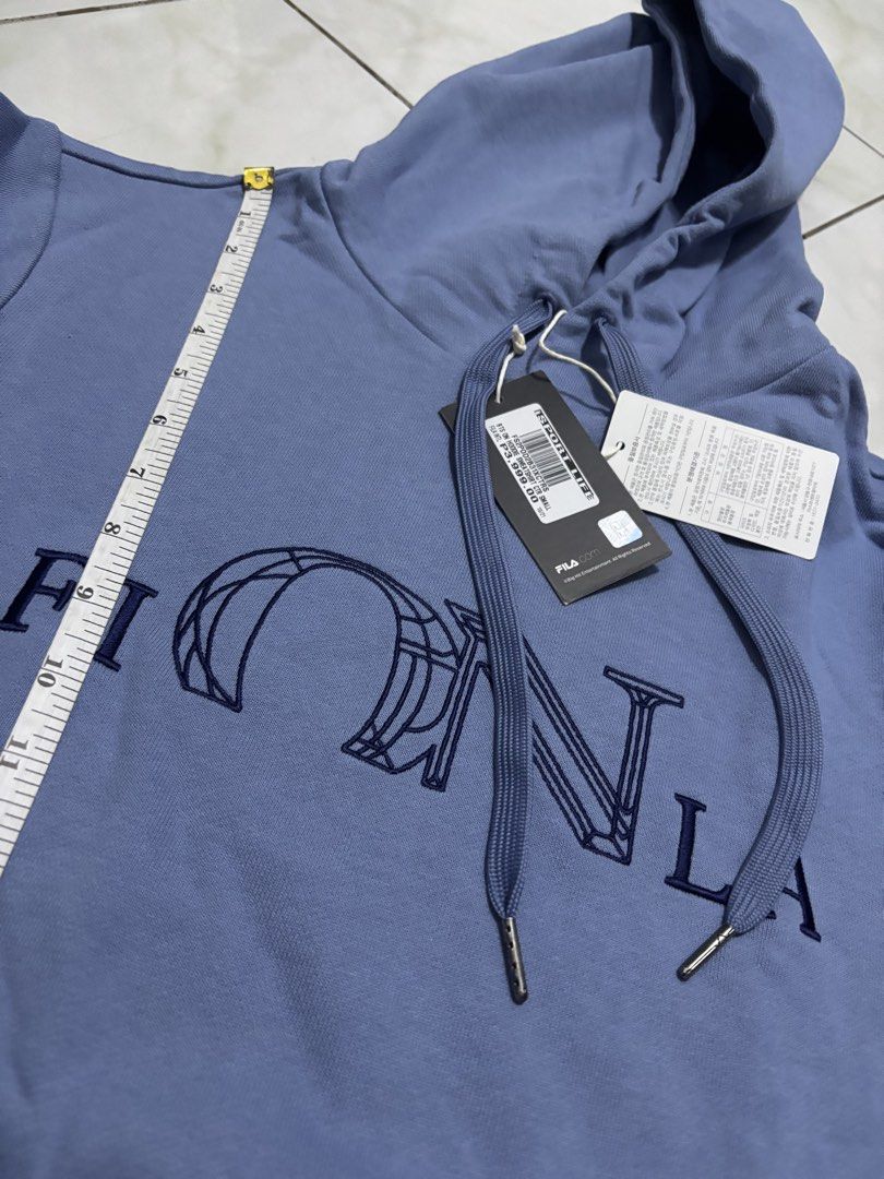 FILA BTS ON Hoodie Sweatshirt CTR Small (Category: Coats, Jackets and Outerwear) located in Muntinlupa City. Submitted by itsmiguel (Listing ID 1447627865, Image 2). Description: - Authentic FILA BTS ON Hoodie Sweatshirt (rare item) - Size: Small (S) - Color: Light Blue / Periwinkle - Features: FILA logo and 'BTS ON' graphic on front - Design: Drawstring hood, front pocket - Condition: Brand new with tags attached - Original Retail Price: P3,999.