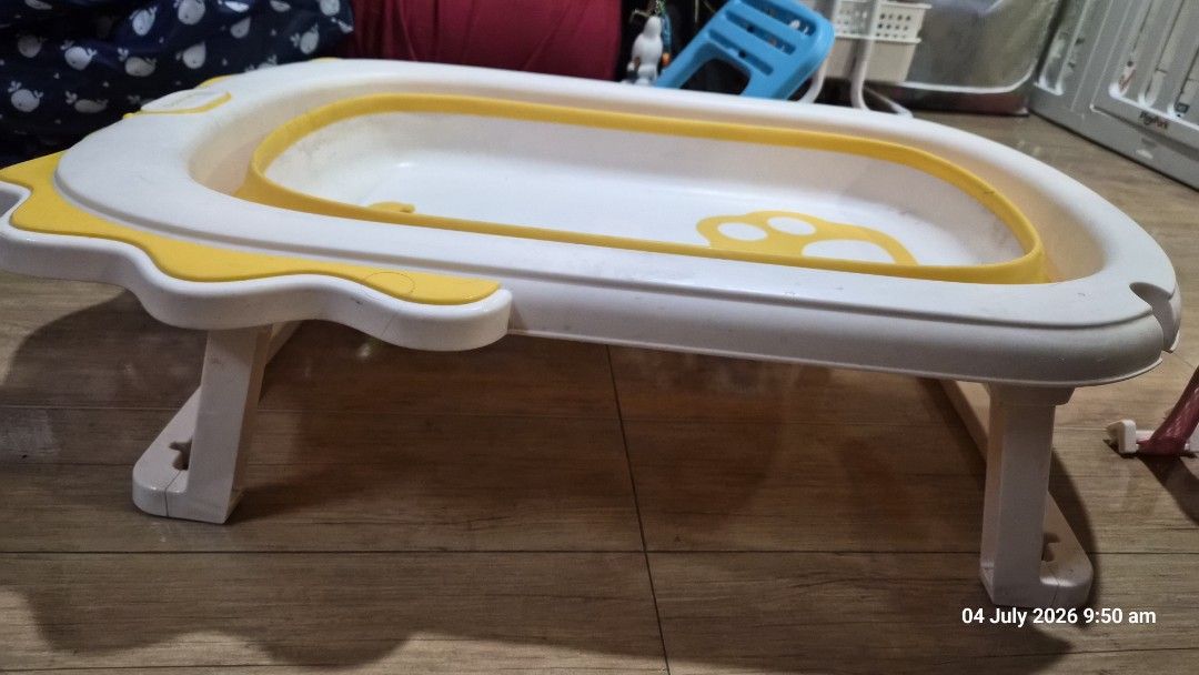Foldable Baby Bathtub with Bath Net (Category: Bathtub & Bath Accessories) located in Pasig City. Submitted by missearly7 (Listing ID 1447487668, Image 1). Description: - White and yellow foldable baby bathtub - Includes pink mesh bath net for baby support - Legs fold for convenient storage - Perfect for making bath time enjoyable - Easy to clean and simple to use - safe for newborn - needs cleaning.