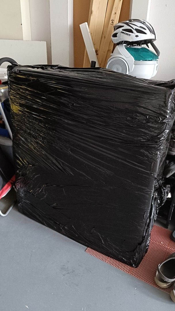 Folderble bed (Category: Occasions & Party Supplies) located in Singapore. Submitted by ritachowyh (Listing ID 1447498654, Image 1). Description: - Large rectangular item - Wrapped in black plastic - Includes helmet and fan on top - Sold as is - Please check photos for condition.
