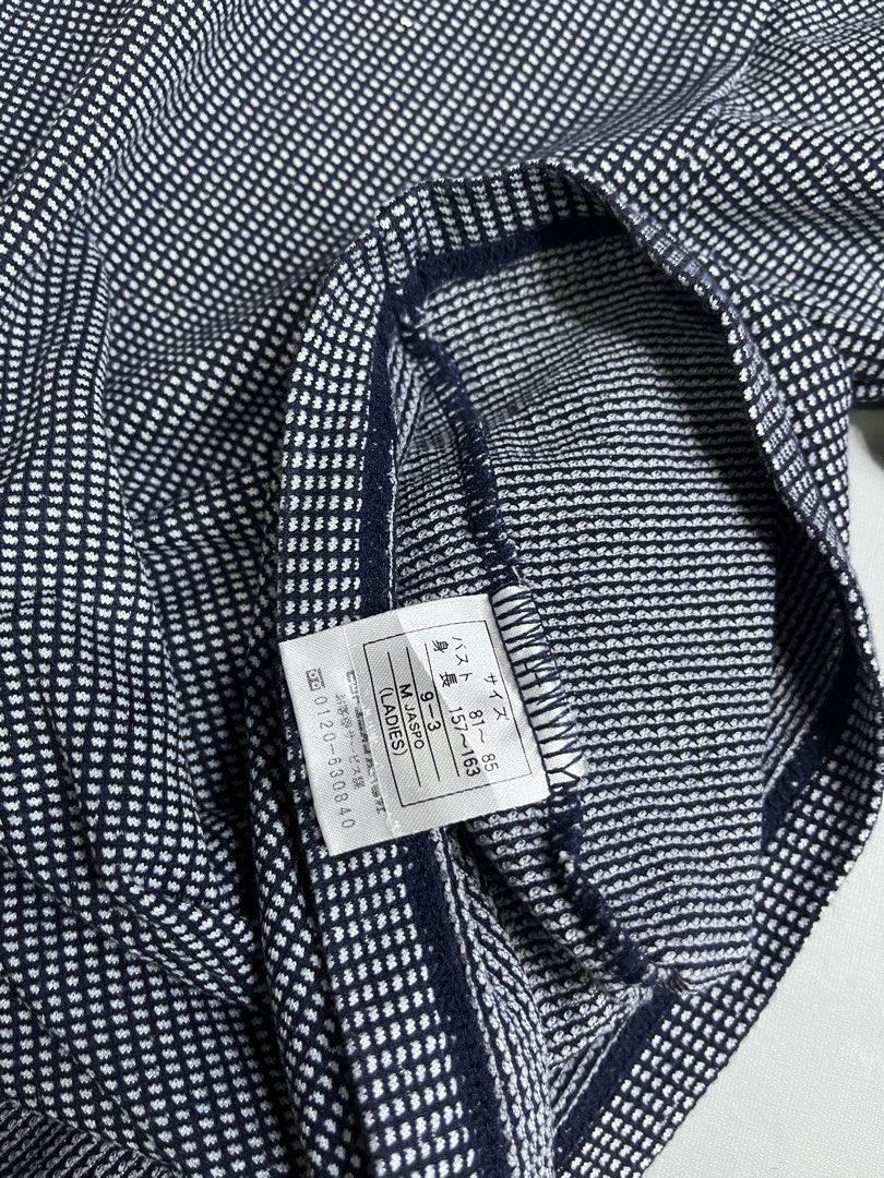 Fred Perry T-shirt Size M Navy White Checkered (Category: Tshirts & Polo Shirts ) located in Mabalacat. Submitted by aas_thriftfings (Listing ID 1447531833, Image 3). Description: - Fred Perry T-shirt - Size: Medium (M) - Color: Navy and white checkered pattern - Features: White trim on collar and sleeve cuffs - Iconic embroidered Fred Perry laurel wreath logo on chest - Material: Comfortable fabric - Ideal for: Casual wear.
