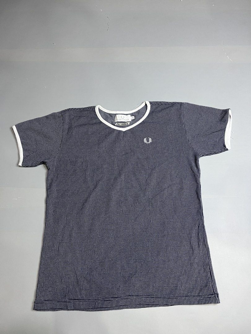 Fred Perry T-shirt Size M Navy White Checkered (Category: Tshirts & Polo Shirts ) located in Mabalacat. Submitted by aas_thriftfings (Listing ID 1447531833, Image 1). Description: - Fred Perry T-shirt - Size: Medium (M) - Color: Navy and white checkered pattern - Features: White trim on collar and sleeve cuffs - Iconic embroidered Fred Perry laurel wreath logo on chest - Material: Comfortable fabric - Ideal for: Casual wear.