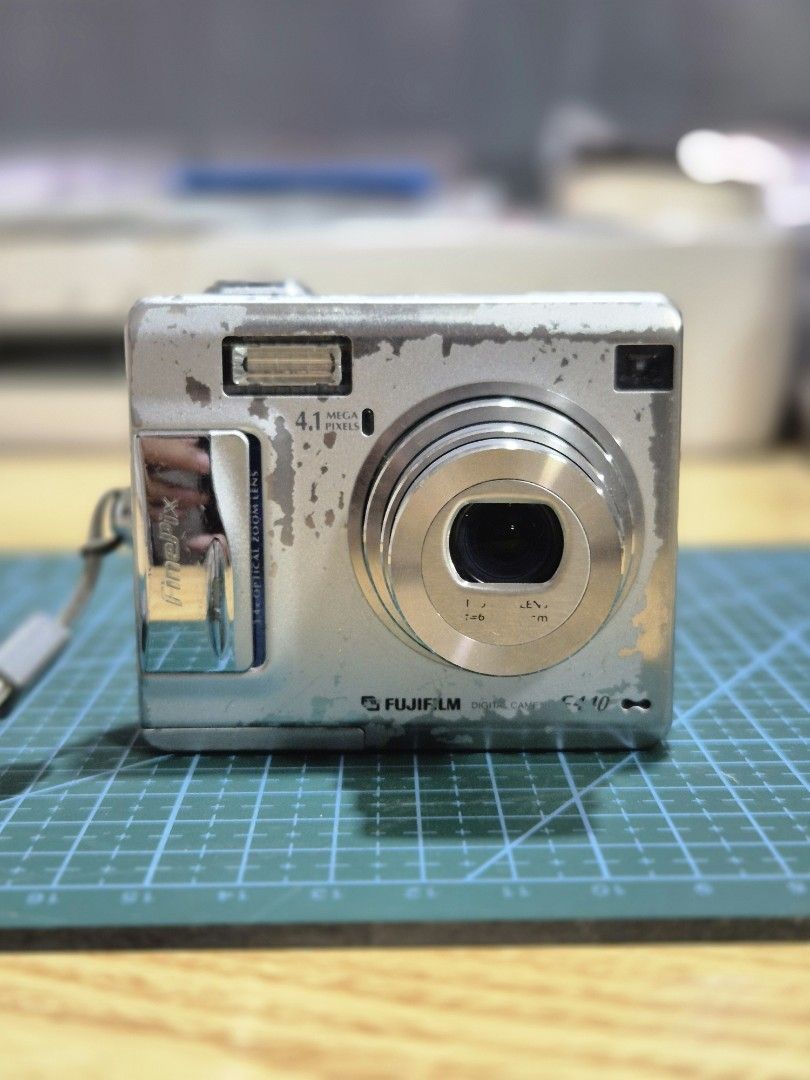 Fujifilm finepix F440 (Category: Cameras) located in Iloilo. Submitted by heyjay10 (Listing ID 1447498571, Image 2). Description: Finepix F440 inclusion: Unit & battery only - working -paint scratches - screen peeling but still usable - all buttons working - Visible dust when pointing directly to light/sun. affects the output - selling as is Loc: Iloilo city shipping available .
