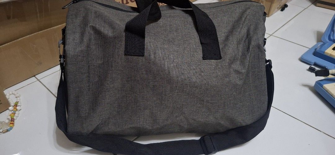 Grey Duffel Bag with Shoulder Strap Unisex (Category: Shoulder Bags) located in Manila. Submitted by youngcloud_b1fffa (Listing ID 1447659327, Image 1). Description: - Grey duffel bag - Top handles and detachable shoulder strap - Wide opening main compartment - Multiple interior pockets for organization - Mesh pocket on one side - Durable material - Ideal for travel or gym use "R&B Mix Japan Surplus Items".
