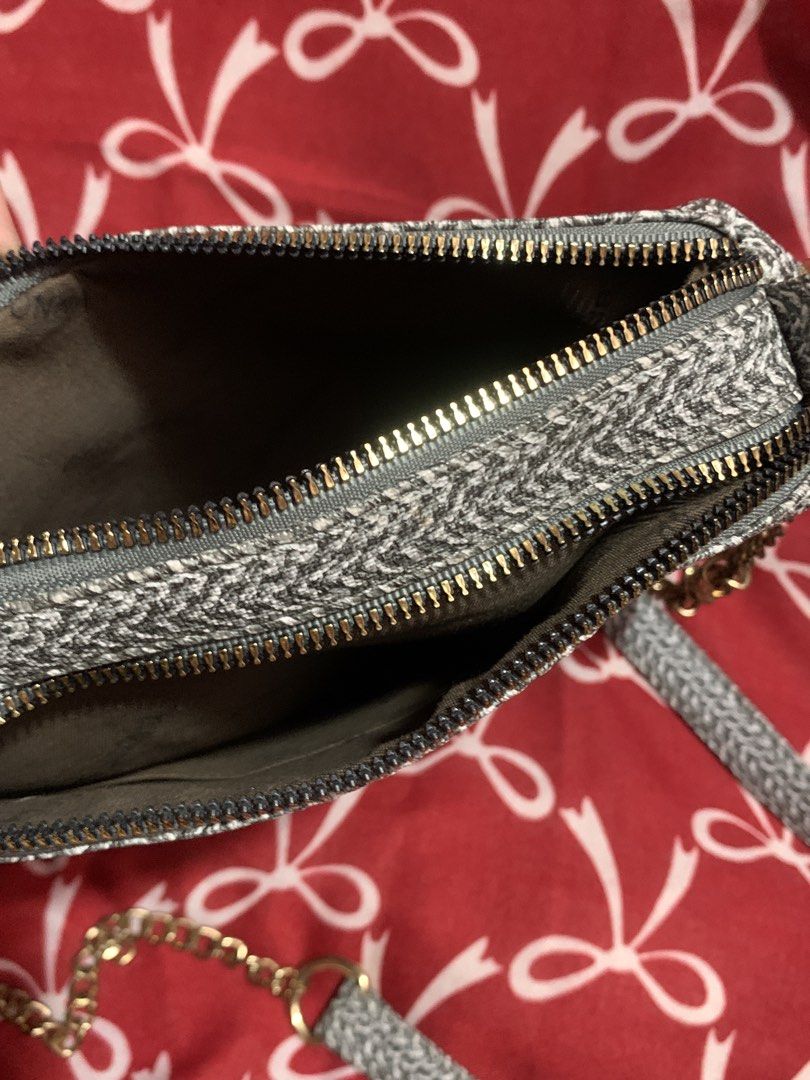 Grey Woven Shoulder Bag with Gold Chain (Category: Shoulder Bags) located in Manila. Submitted by elaitems (Listing ID 1447646206, Image 2). Description: - Will be wash before shipping ‼️ - Grey woven shoulder bag - Secure gold zipper closure - Two interior compartments - Elegant gold chain strap - Small gold logo plate on the front .