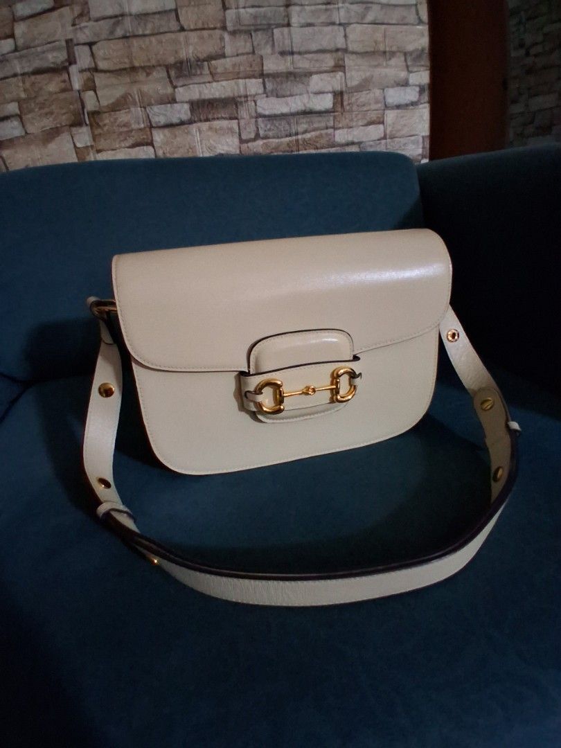 Gucci Horsebit (Rush!) (Category: Luxury Bags & Wallets) located in Quezon City. Submitted by dhexyoblepias (Listing ID 1447478984, Image 1). Description: - Chic cream leather handbag - Features a stylish gold horsebit clasp on the front flap - Adjustable strap with buckle details for a customized fit - Immaculate and clean interior - Versatile: ideal for everyday wear or dressing up for special occasions - Approximate dimensions: [insert dimensi