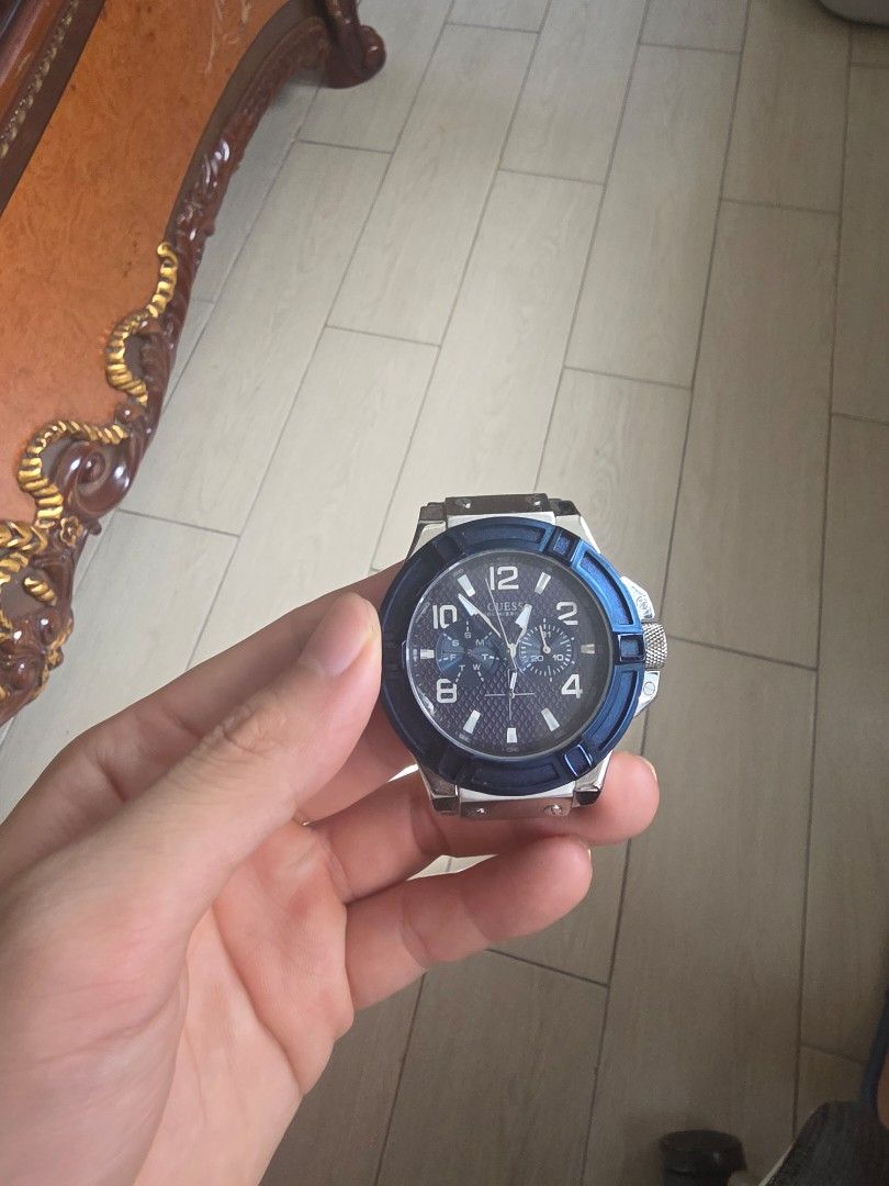 Guess Watch (Category: Women's Watches) located in Manila. Submitted by read_description (Listing ID 1447534609, Image 3). Description: - Guess watch - Black dial with silver hour markers and hands - Blue and black bezel - Visible chronograph subdials - Sporty and stylish design - Perfect for everyday wear issue: no strap and battery.