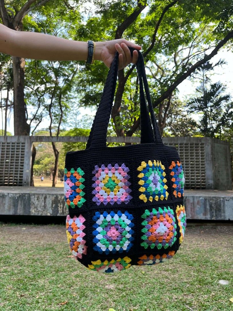 Handmade Crochet Granny Square Tote Bag (Category: Tote Bags) located in Caloocan City. Submitted by mncelle (Listing ID 1447584244, Image 1). Description: Add a pop of color to your daily style with a crochet bag that I personally hand-crafted with so much love and care!Featuring vibrant granny square design, it brings a fun energy to any outfit and perfect as everyday bag because it's not just super cute, but also sturdy and functional for all 