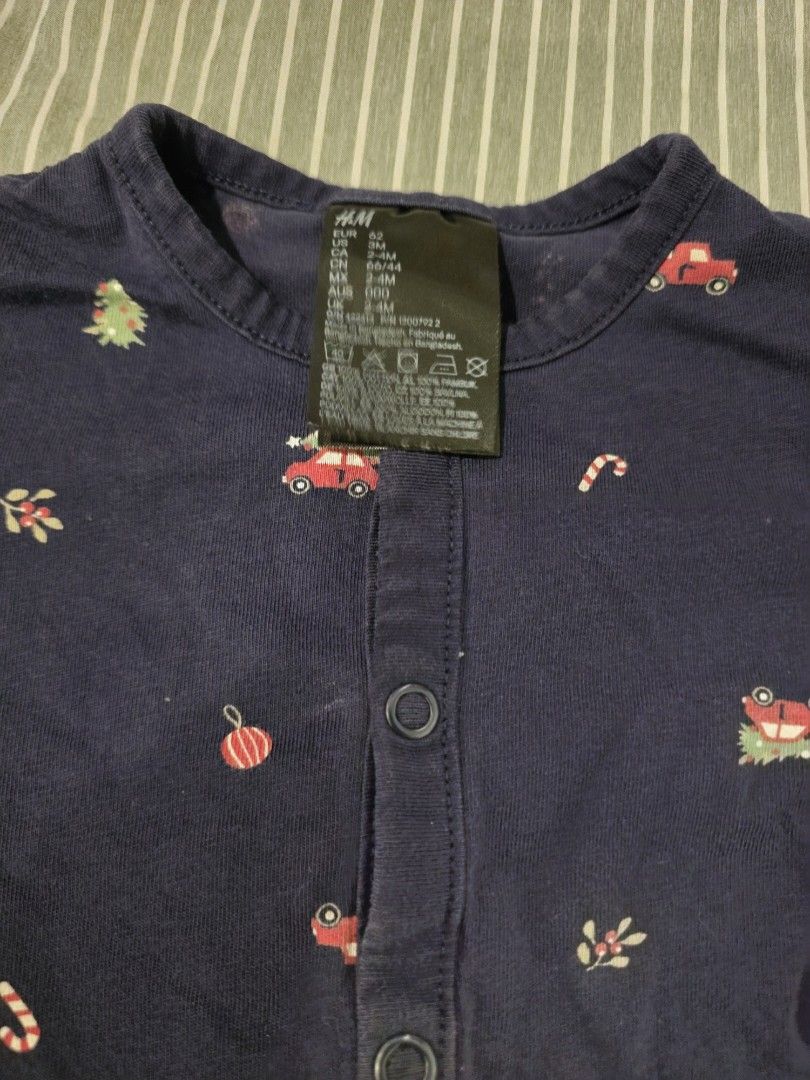 H&M Baby Pantsuit 2-4 Months (Category: Babies & Kids Fashion) located in Paranaque City. Submitted by materesi (Listing ID 1447597447, Image 2). Description: - Navy blue H&M baby romper - Adorable Christmas print: red cars, trees, candy canes - Long sleeves - Convenient snap button closure down the front - Perfect for holiday celebrations and photos!.