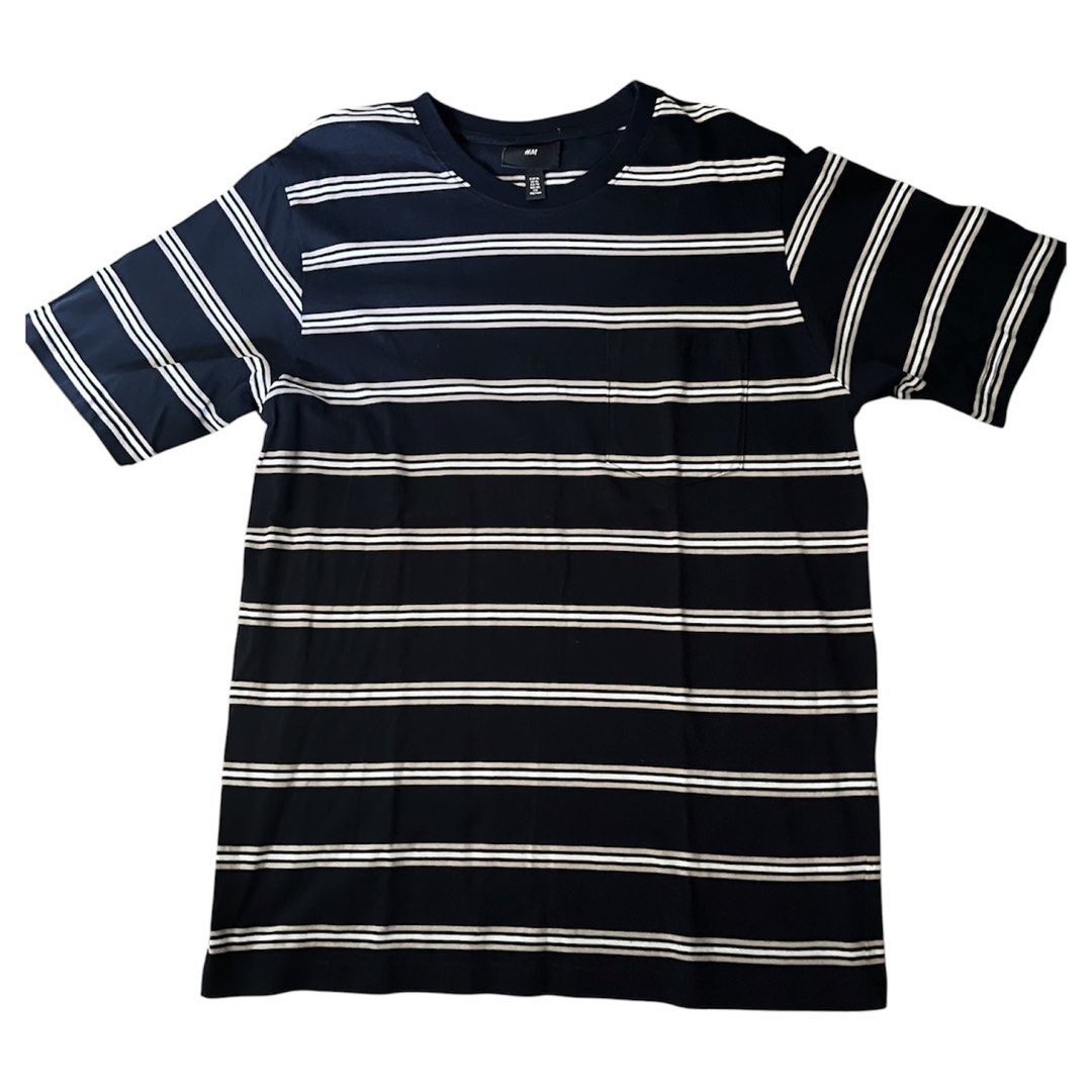 H&M Men Striped T-Shirt (Category: Tshirts & Polo Shirts ) located in Rizal. Submitted by cassappl (Listing ID 1447673941, Image 1). Description: - Classic navy and white stripes - Brand: H&M - Style: Short sleeve, crew neck t-shirt - Features: Small chest pocket - Material: Comfortable, casual fabric - Versatile: Pairs easily with jeans or shorts for everyday wear.