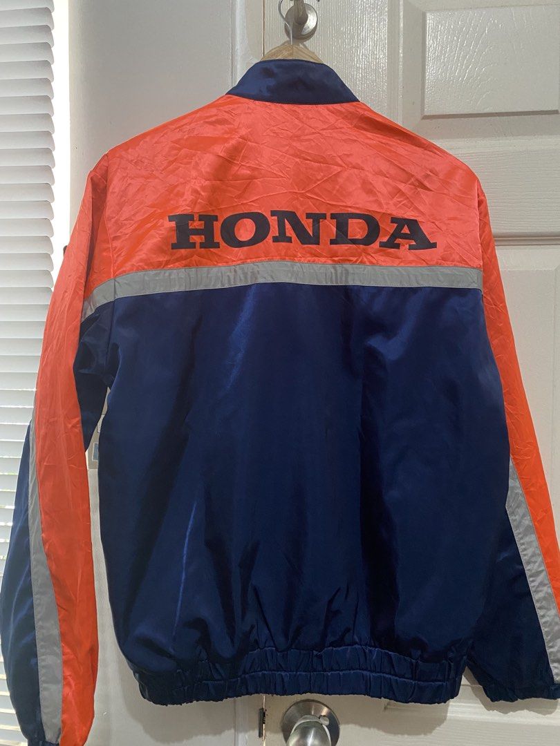 Honda Racing Jacket by Descente (Category: Coats, Jackets and Outerwear) located in Manila. Submitted by avrilarqu43176 (Listing ID 1447576807, Image 3). Description: - Orange and navy blue Honda racing jacket - Made by Descente - Features Honda logo on front and back - Zipper closure with snap button collar - Elasticated cuffs and hem - Two front pockets - Ideal for Honda enthusiasts.