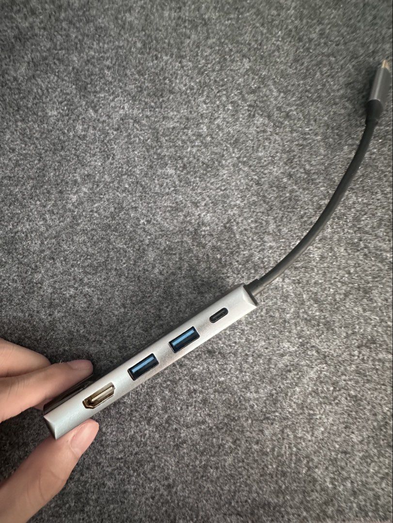 Hytac USB-C Hub Adapter with HDMI, USB 3.0, SD Card Reader (Category: Cables & Adaptors) located in Cainta. Submitted by nezue (Listing ID 1447555190, Image 2). Description: - Hytac USB-C Hub - Sleek silver aluminum casing - Expands laptop connectivity via USB-C - Ports: 1x HDMI, 2x USB 3.0, 1x SD Card Slot - Compact and portable design.