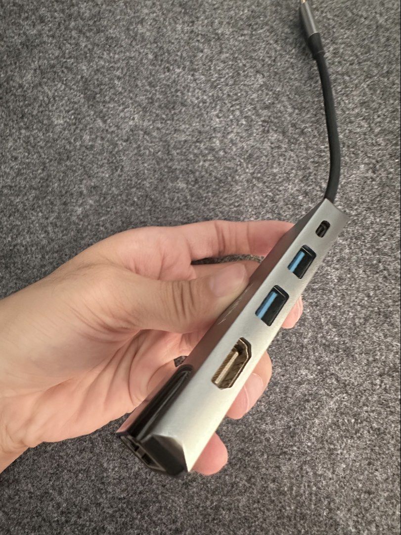 Hytac USB-C Hub Adapter with HDMI, USB 3.0, SD Card Reader (Category: Cables & Adaptors) located in Cainta. Submitted by nezue (Listing ID 1447555190, Image 3). Description: - Hytac USB-C Hub - Sleek silver aluminum casing - Expands laptop connectivity via USB-C - Ports: 1x HDMI, 2x USB 3.0, 1x SD Card Slot - Compact and portable design.