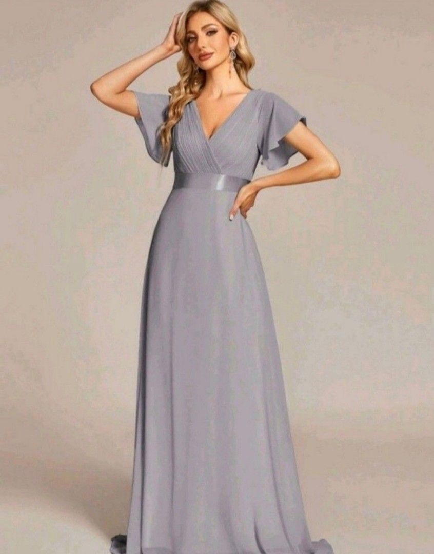 Imported Grey V-Neck Flutter Sleeve Maxi Dress (Category: Dresses) located in Manila. Submitted by phoebecali (Listing ID 1447594026, Image 2). Description: - Elegant grey maxi dress - Flattering V-neckline - Chic flutter sleeves - Satin ribbon detail at the waist - Made of flowy chiffon material - Ideal for formal events, weddings, and parties - Comfortable and stylish - Fits true to size - Only worn once SIZE : XL - XXL Taguig area 0917-240-46-
