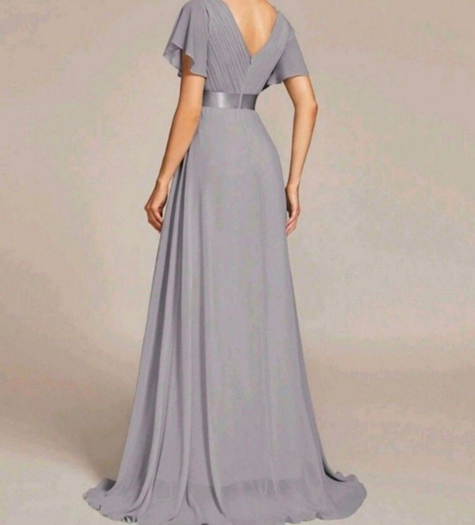 Imported Grey V-Neck Flutter Sleeve Maxi Dress (Category: Dresses) located in Manila. Submitted by phoebecali (Listing ID 1447594026, Image 3). Description: - Elegant grey maxi dress - Flattering V-neckline - Chic flutter sleeves - Satin ribbon detail at the waist - Made of flowy chiffon material - Ideal for formal events, weddings, and parties - Comfortable and stylish - Fits true to size - Only worn once SIZE : XL - XXL Taguig area 0917-240-46-