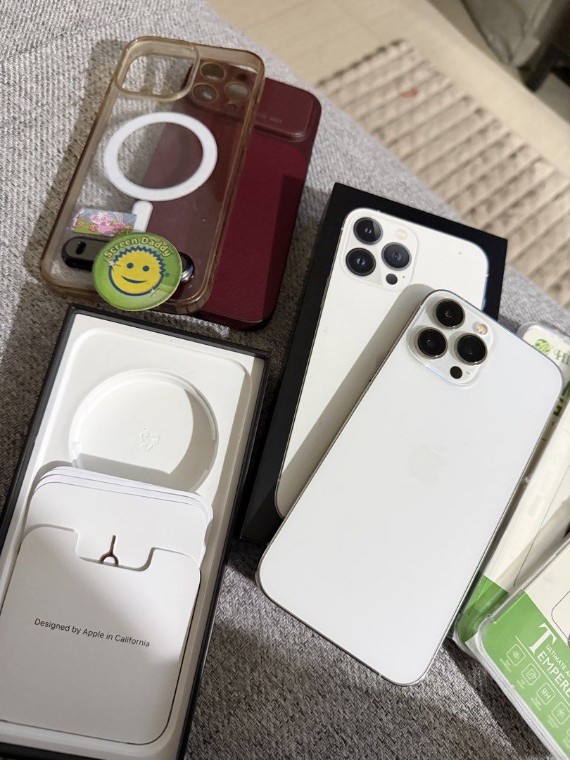iPhone 13 pro max, 512 gb (Category: Cases & Sleeves) located in Pasig City. Submitted by declutterwithai (Listing ID 1447520501, Image 2). Description: - iPhone 13 Pro Max, 512GB, White - Lady-owned, 8.5/10 condition - Battery Health: 75% - Inclusions: Original Box, Charger, SIM Pin, 2 Cases, 3 Screen Protectors - No SIM restrictions, never opened or repaired - Minor cosmetic issue: Tiny spot on 3x zoom photo (does not affect performance or vide