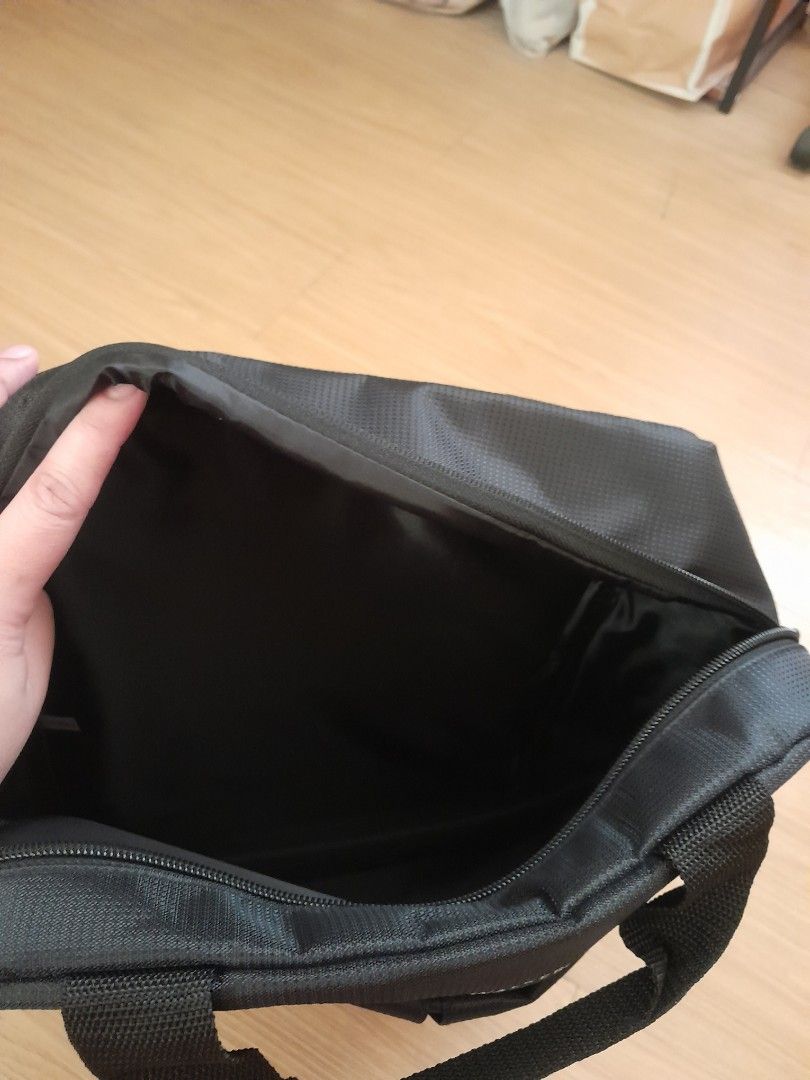 Johnnie Walker Black Nylon Laptop Bag (Category: Laptop Bags & Sleeves) located in Angeles City. Submitted by declutterhub (Listing ID 1447492024, Image 3). Description: - Black nylon bag with Johnnie Walker branding - Main zippered compartment - Outer pocket for quick access - Adjustable straps for comfortable carrying - Ideal for laptops or documents - Clean inside and out, ready for its new owner.