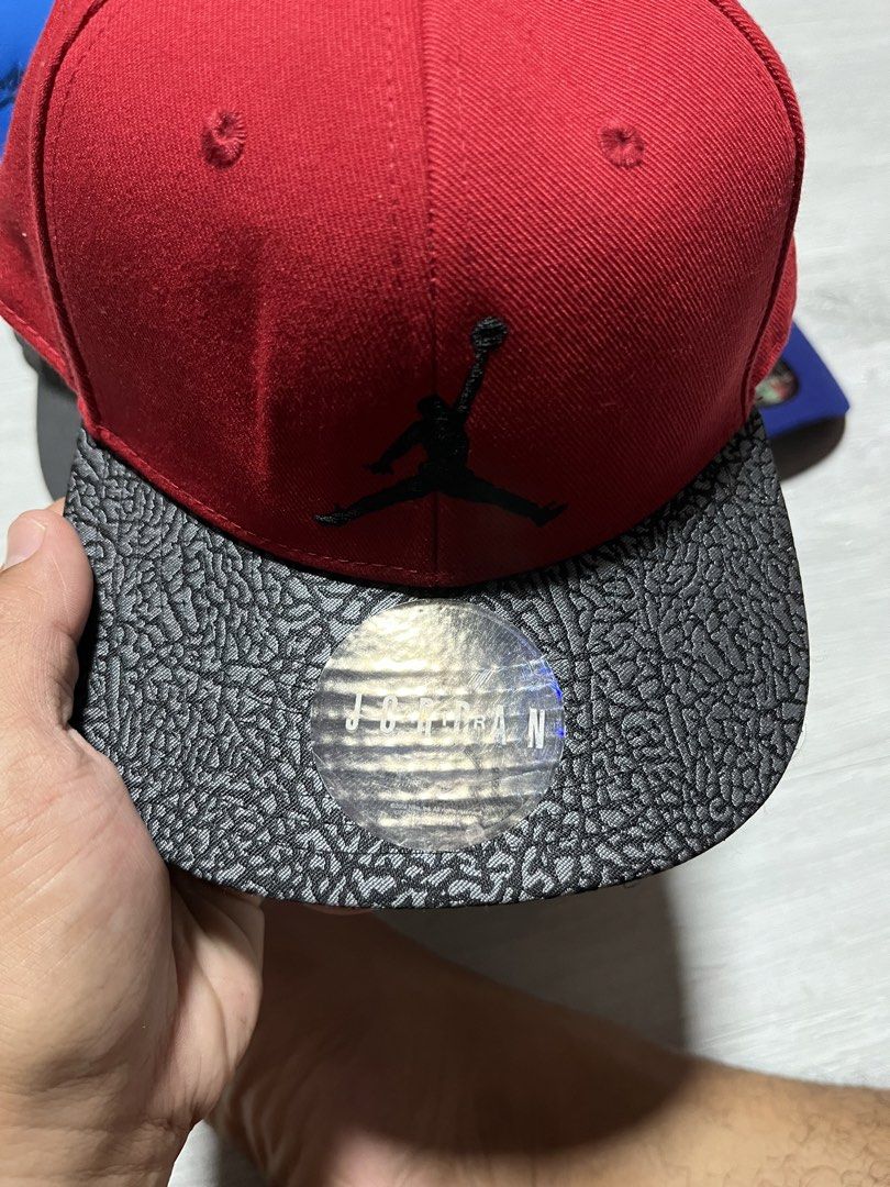 Jordan Jumpman Snapback Cap Red Black Elephant Print (Category: Caps & Hats) located in Manila. Submitted by jorgemabelin2001 (Listing ID 1447496753, Image 2). Description: - Red Jordan snapback cap - Features the iconic Jumpman logo on the front - Classic elephant print design on the brim - Adjustable snapback closure for a custom fit - Interior Jumpman branding on the sweatband - A must-have for any Jordan enthusiast.