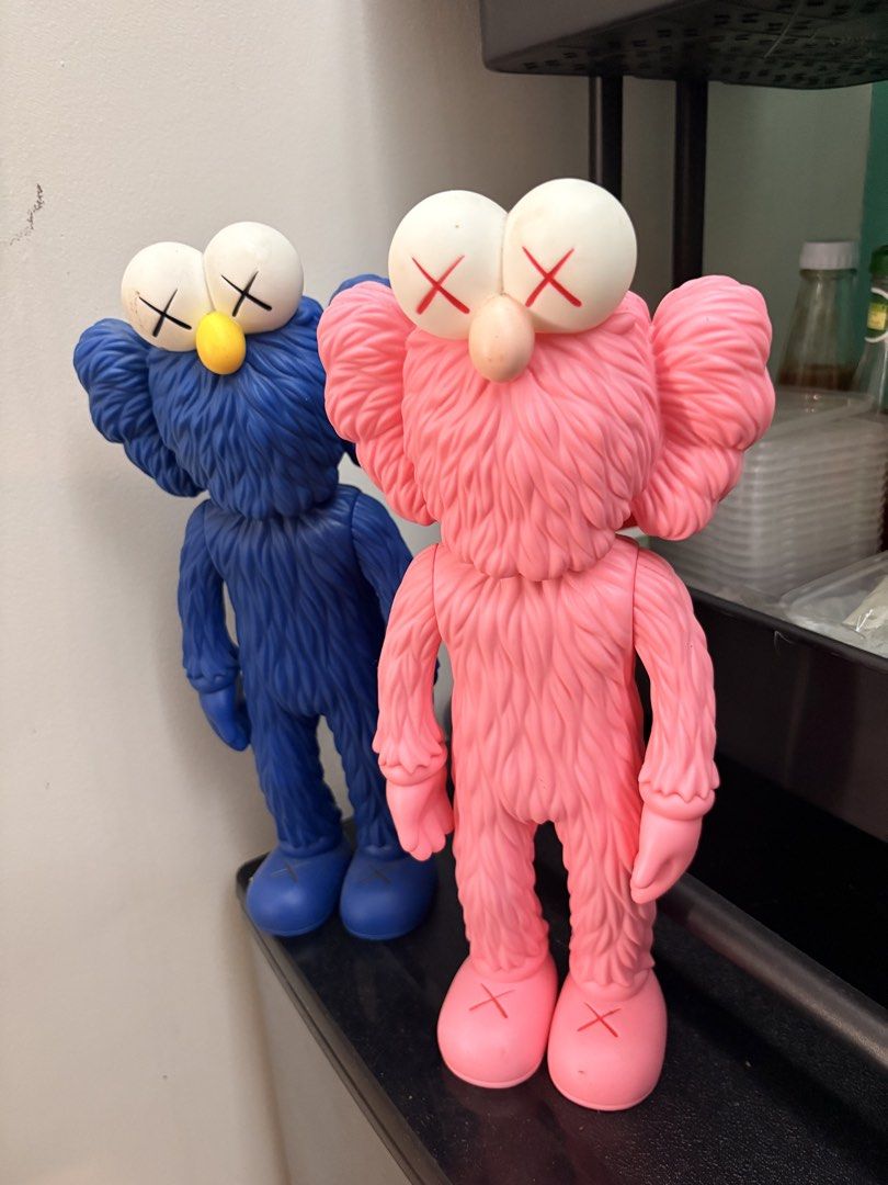 KAWS Companion Figures - Blue and Pink (Category: Figurines & Statues) located in Mabalacat. Submitted by ken_reyes0918 (Listing ID 1447656455, Image 2). Description: - Set of 2 KAWS Companion Figures (Blue and Pink) - Iconic art toys, perfect for collectors - Stands approximately 11 inches tall - No original box included.