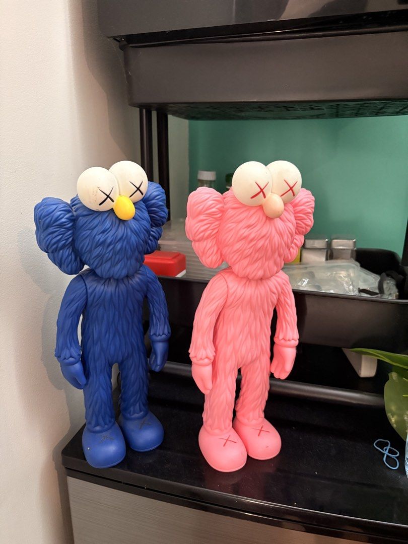 KAWS Companion Figures - Blue and Pink (Category: Figurines & Statues) located in Mabalacat. Submitted by ken_reyes0918 (Listing ID 1447656455, Image 1). Description: - Set of 2 KAWS Companion Figures (Blue and Pink) - Iconic art toys, perfect for collectors - Stands approximately 11 inches tall - No original box included.