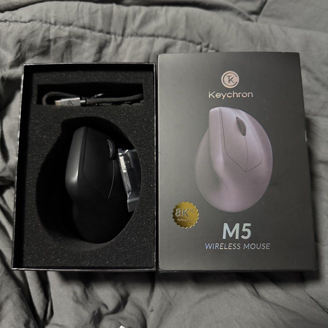 Keychron M5 Wireless Mouse (Category: Mouse & Mousepads) located in Quezon City. Submitted by dmdmdmdm (Listing ID 1447513043, Image 1). Description: - Keychron M5 Wireless Mouse - Ergonomic vertical design for natural handshake - High-precision 30K DPI optical sensor - Extended battery life: Up to 140 hours - Lightweight build: Only 92g - Compatible with macOS and Windows - Includes unused USB-C cable and dongles/receiver - Bought from Datablitz