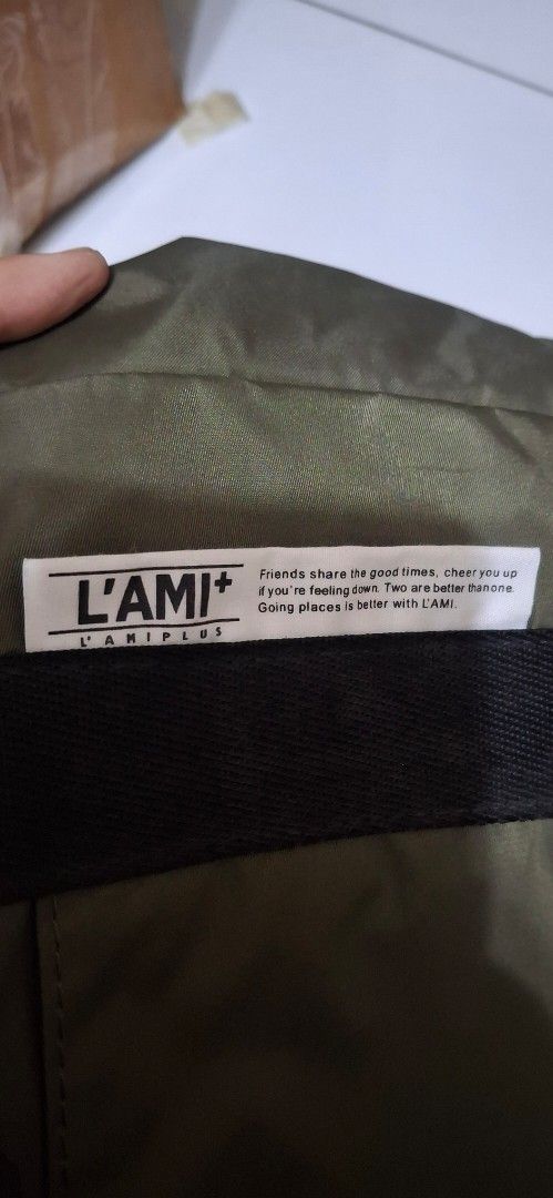 L'AMI+ Tote Bag Khaki Green (Category: Tote Bags) located in Manila. Submitted by youngcloud_b1fffa (Listing ID 1447655666, Image 1). Description: - Khaki green L'AMI+ tote bag - Main zip compartment for secure storage - Two side pockets with adjustable drawstring closure - Durable handles for comfortable carrying - Detachable and adjustable shoulder strap for versatility - Spacious interior, ideal for everyday essentials or travel needs "R&B Mix