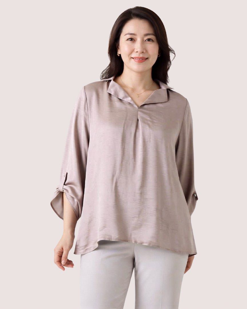 Élan Satin Collared Blouse - Rose Gold (Category: Blouses) located in San Juan City. Submitted by mscloset3 (Listing ID 1447538023, Image 1). Description: - Élan brand blouse - Beautiful rose gold color with a satin sheen - Collared neckline with a V-split - Sleeves can be rolled up and secured with a button tab - Perfect for dressing up or down - Comfortable and stylish - Model photo shown for reference only. See product images for the actual it