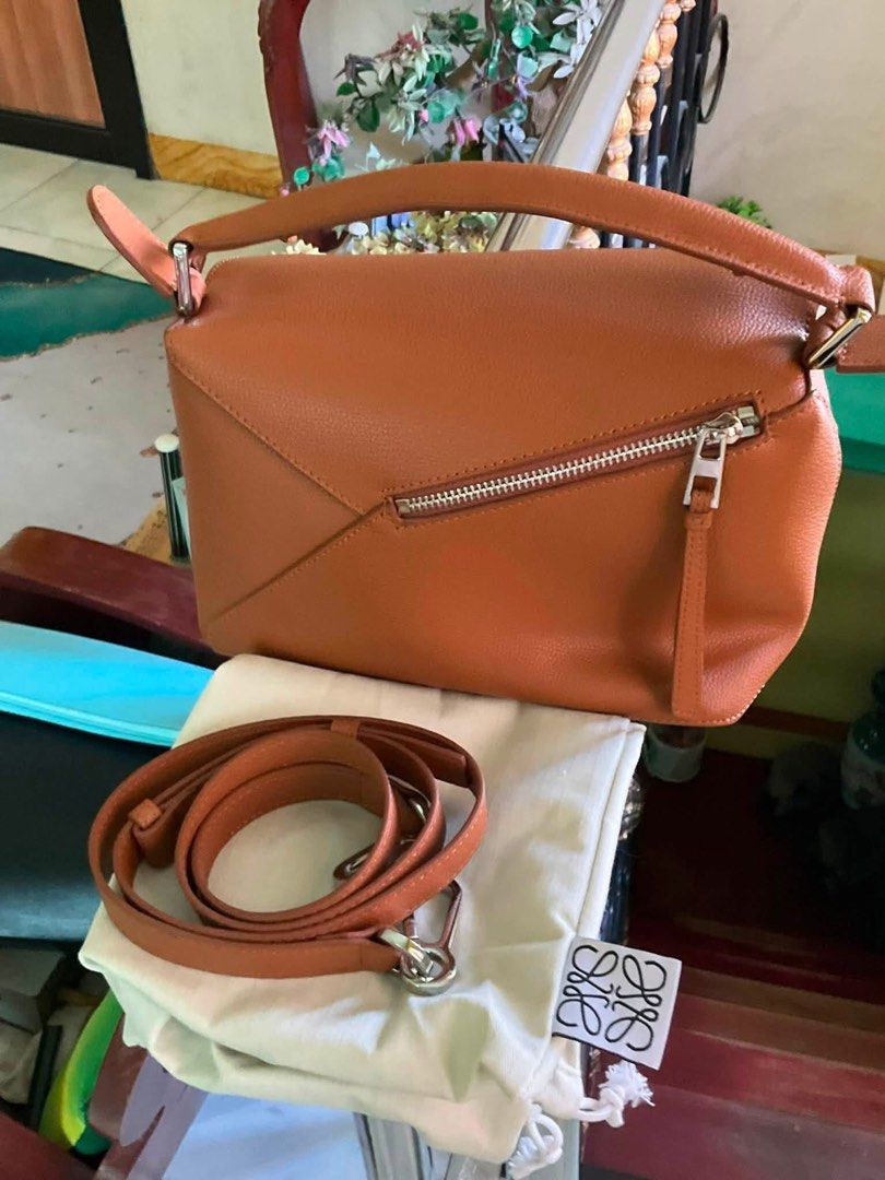 Loewe Small Puzzle Edge (Category: Luxury Bags & Wallets) located in Cabuyao City. Submitted by girliecloset202434 (Listing ID 1447588679, Image 3). Description: Brand: Loewe Color: Konjac/ Brown Condition: Rank S (no flaws), considered as bnew) Material: Pebbled Leather Inclusion/s: Dustbag only Coded✅ ( ask us for the picture) Please read ⬇️ Buy at your own risk! Shipping fee not included Last price upon request only for sure buyers! No return 