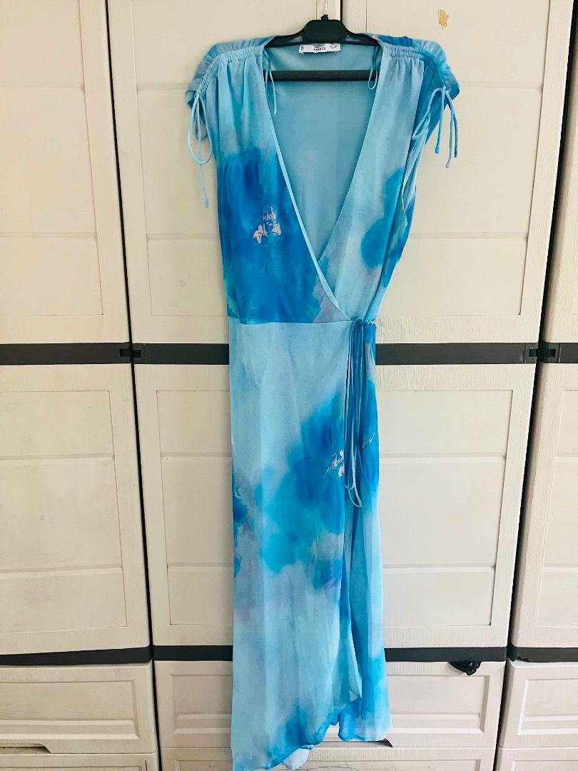 Mango dress ( italian fabric) (Category: Dresses) located in Manila. Submitted by 123wazelanne123 (Listing ID 1447532723, Image 3). Description: - Brand: Mango - Material: Italian Fabric - Color: Blue watercolor print - Style: Wrap dress - Size: S (EUR 36 / US 4 / MEX 4) - Features: Flowy, lightweight, adjustable tie waist, ruched sleeves - Condition: Excellent - can fit up to medium - bouth for 3890.