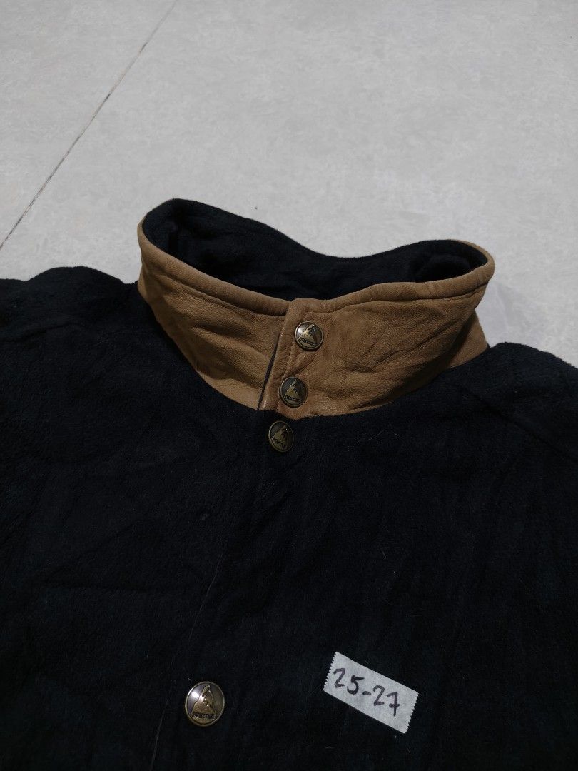 Marmot Black Bomber Jacket with Brown Accents (Category: Coats, Jackets and Outerwear) located in Quezon City. Submitted by jamtnf (Listing ID 1447643240, Image 3). Description: - Black Marmot jacket - Bomber style - Size: Medium (M) - Maroon lining - Brown leather accents on collar and pockets - Water repellent shell - Crushed polyester fleece content - Ideal for outdoor activities and casual wear - Care: Dry clean only; do not wash leather part