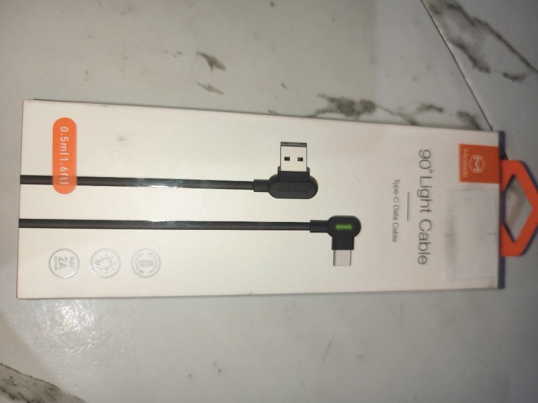 Mcdodo 90° Light USB-C Data Cable 0.5m (Category: Cables & Adaptors) located in Paranaque City. Submitted by blitz.wiz (Listing ID 1447596223, Image 1). Description: - Mcdodo 90-degree USB-C Cable - Length: 0.5 meters - Features a convenient light indicator on the Type-C end - Durable braided cable for long-lasting use - Ideal for gaming and charging at comfortable angles - Supports fast data transfer - Comes with a velcro strap for easy storage 