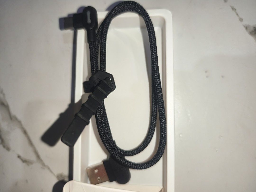 Mcdodo 90° Light USB-C Data Cable 0.5m (Category: Cables & Adaptors) located in Paranaque City. Submitted by blitz.wiz (Listing ID 1447596223, Image 3). Description: - Mcdodo 90-degree USB-C Cable - Length: 0.5 meters - Features a convenient light indicator on the Type-C end - Durable braided cable for long-lasting use - Ideal for gaming and charging at comfortable angles - Supports fast data transfer - Comes with a velcro strap for easy storage 