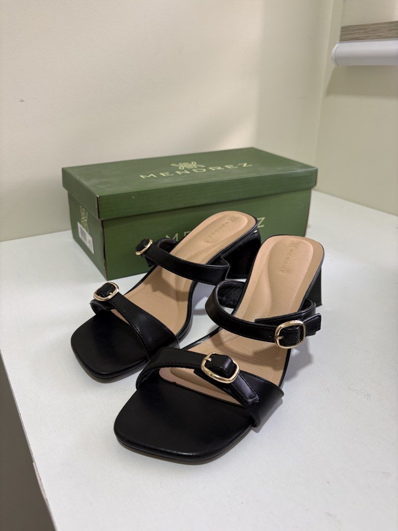 Size 7 - Mendrez Black Double Strap Block Heels Sandals (Category: Heels) located in Mandaluyong City. Submitted by twonett (Listing ID 1447563433, Image 1). Description: - Bought for 1,500 - Used once - Brand: Mendrez - Color: Black - Design: Square toe with gold buckle detail - Heel: Comfortable block heel - Style: Easy slip-on - Includes: Original box.
