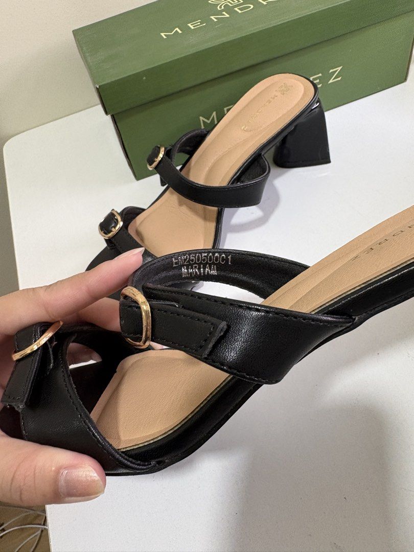 Size 7 - Mendrez Black Double Strap Block Heels Sandals (Category: Heels) located in Mandaluyong City. Submitted by twonett (Listing ID 1447563433, Image 2). Description: - Bought for 1,500 - Used once - Brand: Mendrez - Color: Black - Design: Square toe with gold buckle detail - Heel: Comfortable block heel - Style: Easy slip-on - Includes: Original box.