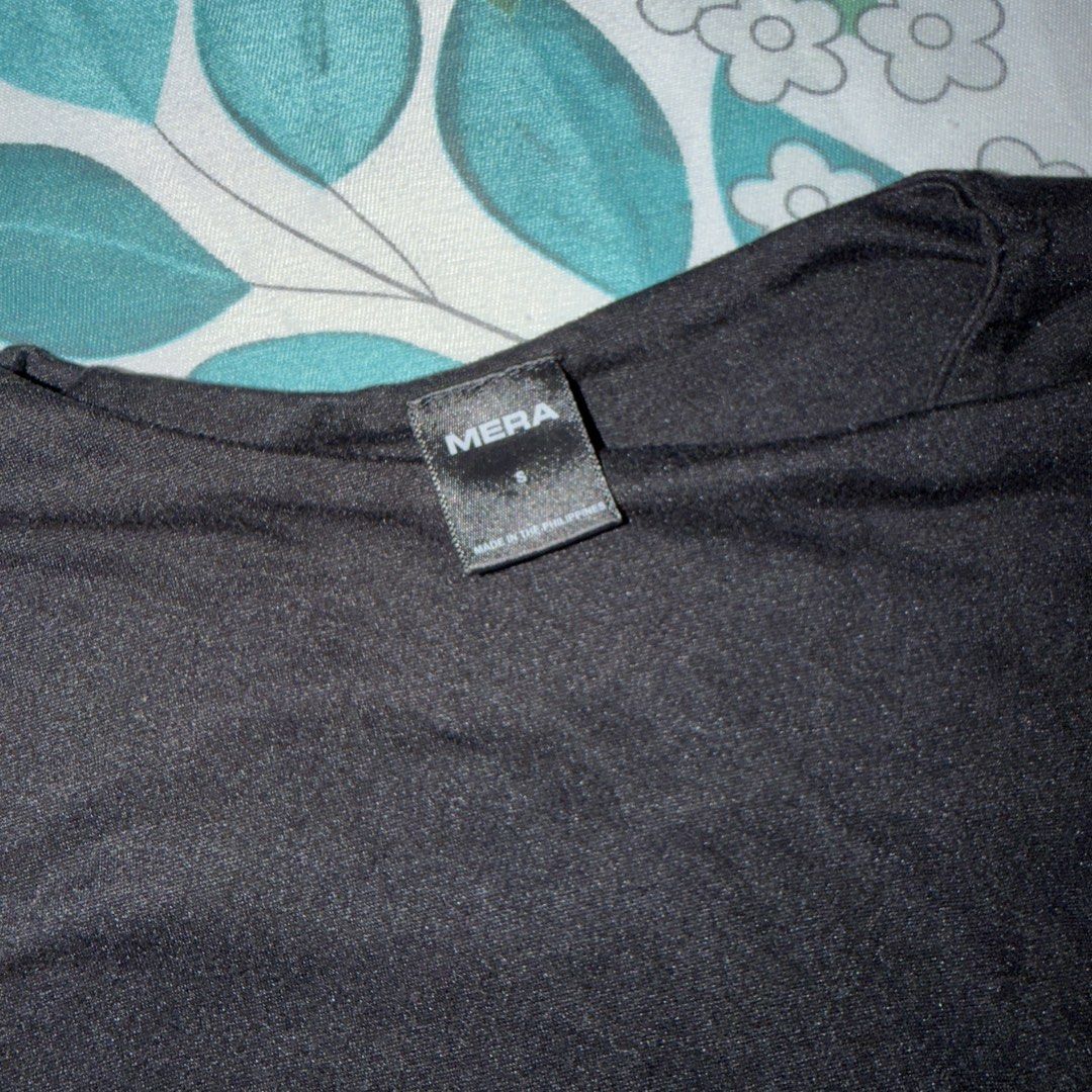 MERA Black T-shirt Top (Category: Shirts) located in Quezon City. Submitted by izanari (Listing ID 1447588354, Image 2). Description: - Brand: MERA - Color: Black - Fits XS/S - Style: Basic T-Shirt - Features: Double Lined Short sleeves, Crew neck - Versatility: Ideal for everyday wear.