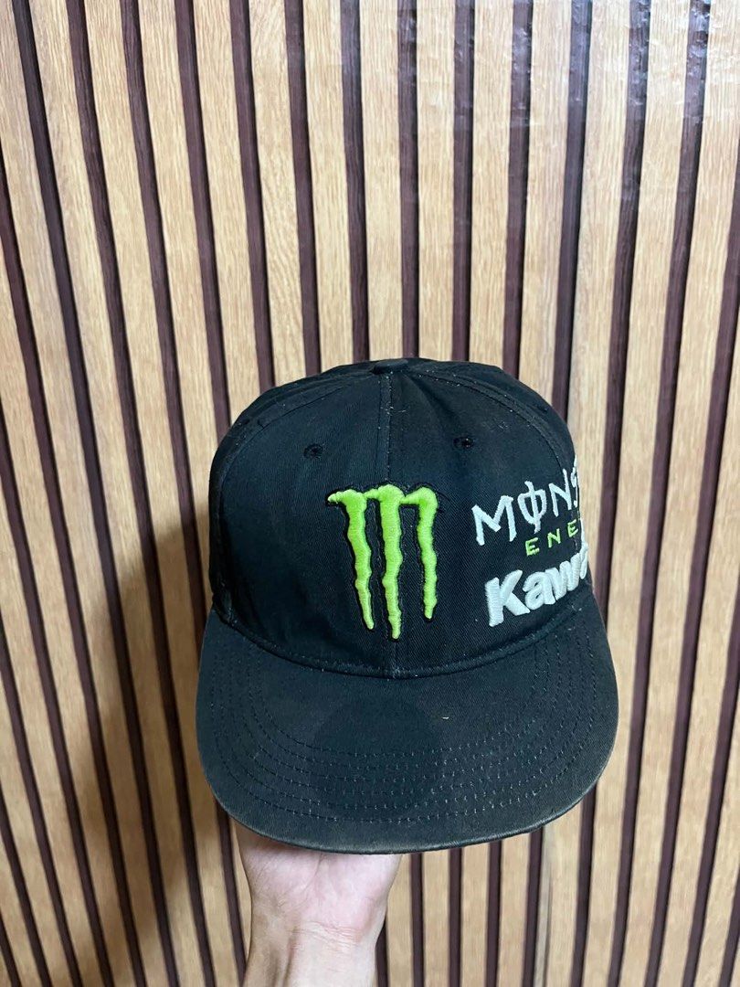 Monster Energy Kawasaki Racing Baseball Cap (Category: Caps & Hats) located in Santiago. Submitted by bakithrift (Listing ID 1447597828, Image 3). Description: - Black baseball cap with Monster Energy and Kawasaki logos. - Iconic Monster claw logo prominently displayed on the front. - Interior lining features a repeating Kawasaki pattern. - Adjustable strap at the back for a customized fit. - Ideal for fans of racing and energy drinks..