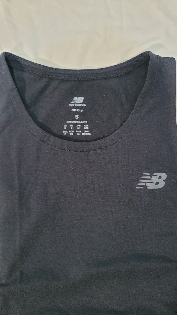 New Balance Running Tank Top Size S (Category: Activewear) located in Davao. Submitted by NearlyNew (Listing ID 1447509082, Image 2). Description: - Grey New Balance running tank top - Lightweight and breathable material - Ideal for workouts or casual wear - Size: S - Please check photos for condition details.