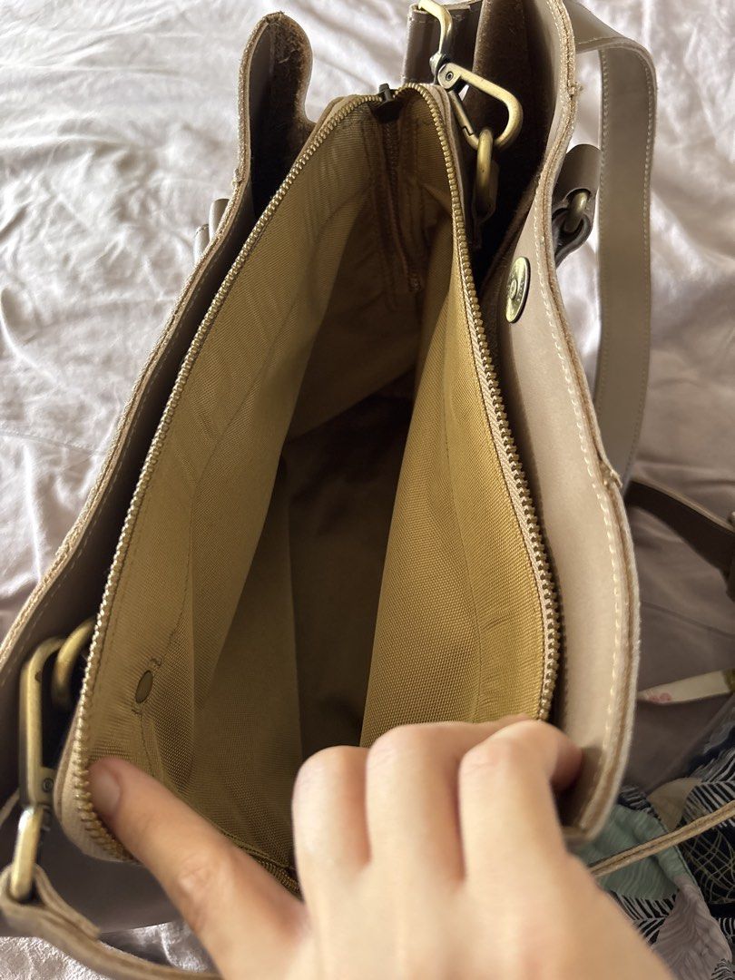 Ni QUA Custom Mezzo Medium Bag (Category: Tote Bags) located in San Pedro. Submitted by rissy0205 (Listing ID 1447493184, Image 3). Description: - Brand: Ni QUA - Color: Taupe - Genuine leather - Structured but lightweight - Double compartment with magnetic enclosure for both sizes - Internal: partially lined in the middle part - Estimated bag weight: 750 grams - Size: 10″H x 12″W x 6″D with handle drop of 6″ - With dust bag - Bought for around P