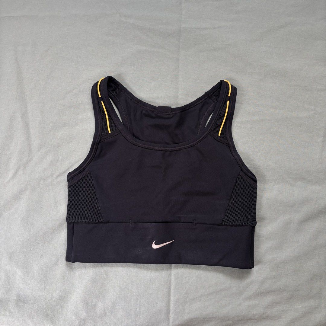 NIKE black sports bra (Category: Activewear) located in Quezon City. Submitted by _amcc (Listing ID 1447554907, Image 1). Description: - used 3x.