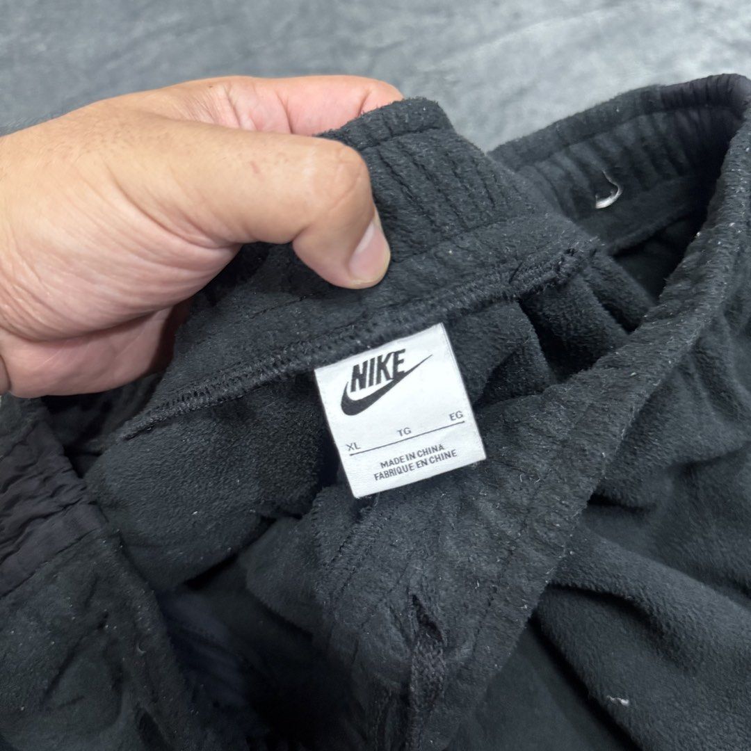 NIKE FLEECE JOGGER PANTS (Category: Joggers) located in Santa Maria. Submitted by rarefindslt (Listing ID 1447511741, Image 2). Description: NIKE FLEECE JOGGER PANTS (SWIPE LEFT FOR MORE DETAILS..) L on tag in solid good condition rate! with tags for authenticity, adjustable string, side pockets, embroidered side swoosh script logo, heavy cotton material, in solid black color rate! (photo may vary due to lighting but solid black color rate) can p