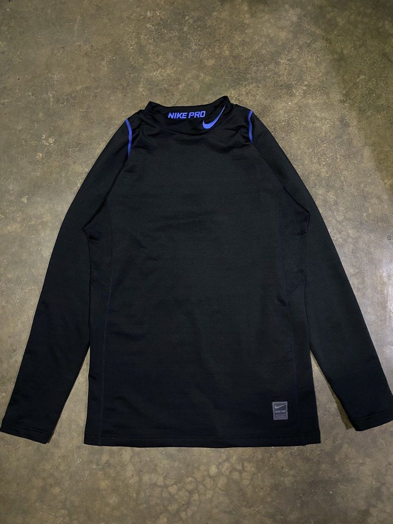 Nike Pro Hyperwarm Compression Long Sleeve Shirt (Category: Activewear) located in Malabon City. Submitted by yivsthrift (Listing ID 1447645147, Image 1). Description: - Black Nike Pro Hyperwarm Compression Long Sleeve Shirt - Blue accents on collar and shoulders - Size: L - Offers warmth and compression - Ideal for training or everyday wear - 28 x 17.