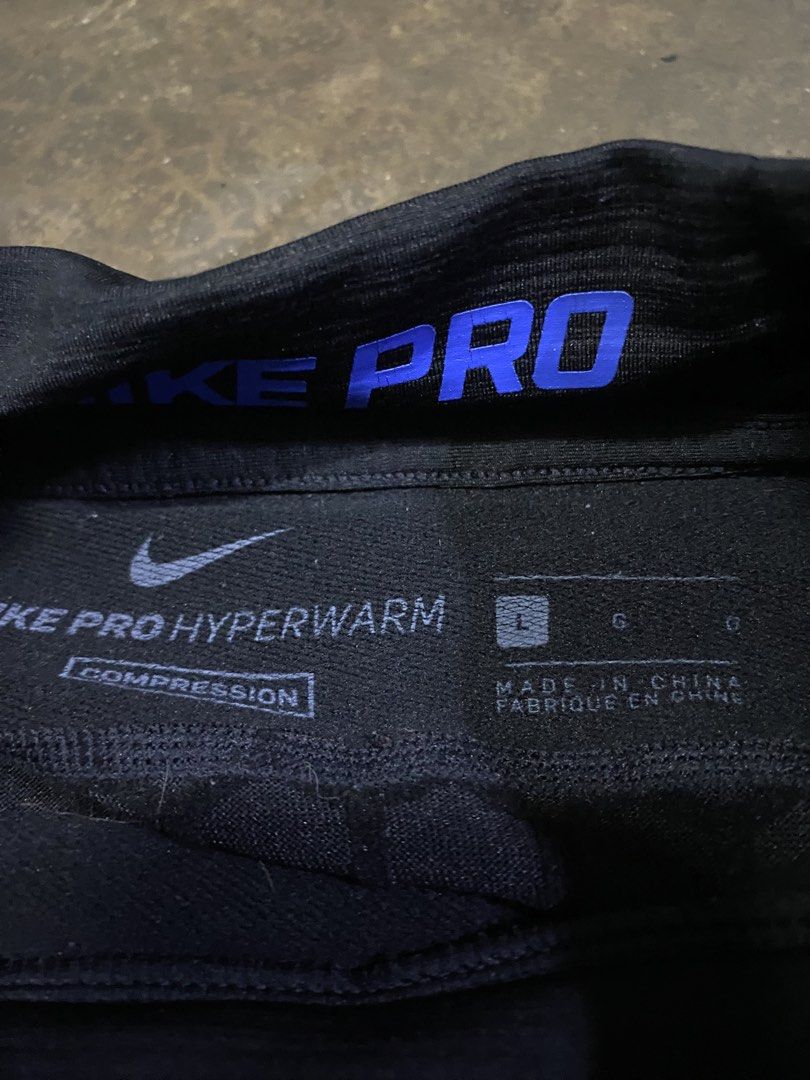 Nike Pro Hyperwarm Compression Long Sleeve Shirt (Category: Activewear) located in Malabon City. Submitted by yivsthrift (Listing ID 1447645147, Image 3). Description: - Black Nike Pro Hyperwarm Compression Long Sleeve Shirt - Blue accents on collar and shoulders - Size: L - Offers warmth and compression - Ideal for training or everyday wear - 28 x 17.