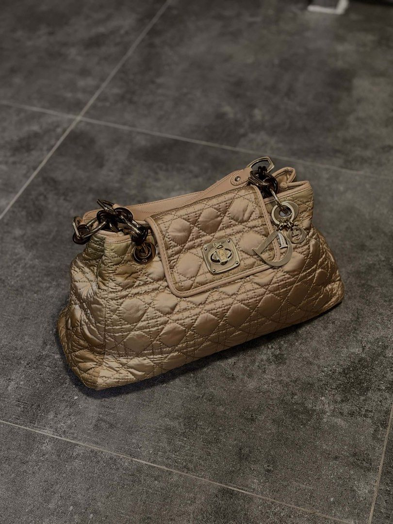 Original Dior Charming Lock Flap bag (Category: Luxury Bags & Wallets) located in Rizal. Submitted by bingbong21 (Listing ID 1447535549, Image 1). Description: - Authentic gold Dior shoulder bag - Elegant quilted pattern all over - Iconic Dior charms attached - Stylish chain strap - Secure front flap with clasp closure - Versatile for daily wear or special events - Note: Shows some signs of wear on the corners -shipping via JNT and lalamove.