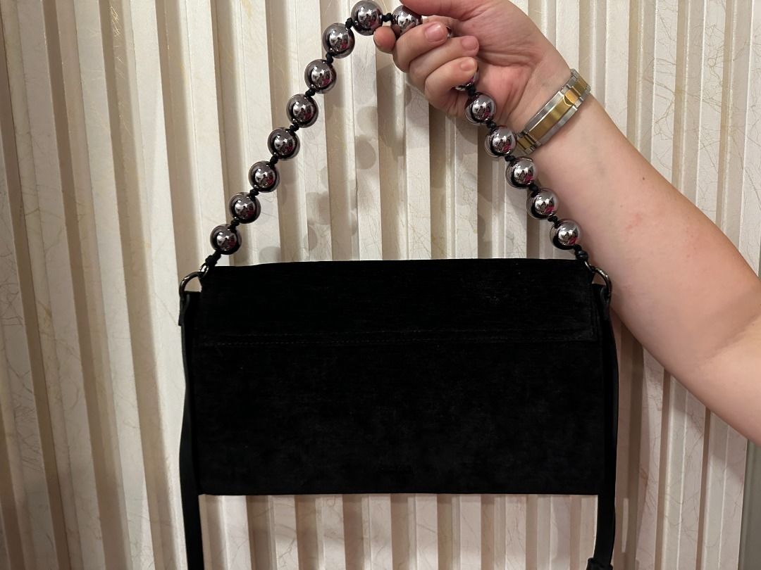 Parfois Wallet Bag with Beaded Handle (Category: Shoulder Bags) located in Marikina City. Submitted by dearly__ (Listing ID 1447603871, Image 2). Description: - Black suede shoulder bag - Unique beaded handle - Magnetic snap closure - small dent on shoulder strap (unoticeable) Location: Marikina City.