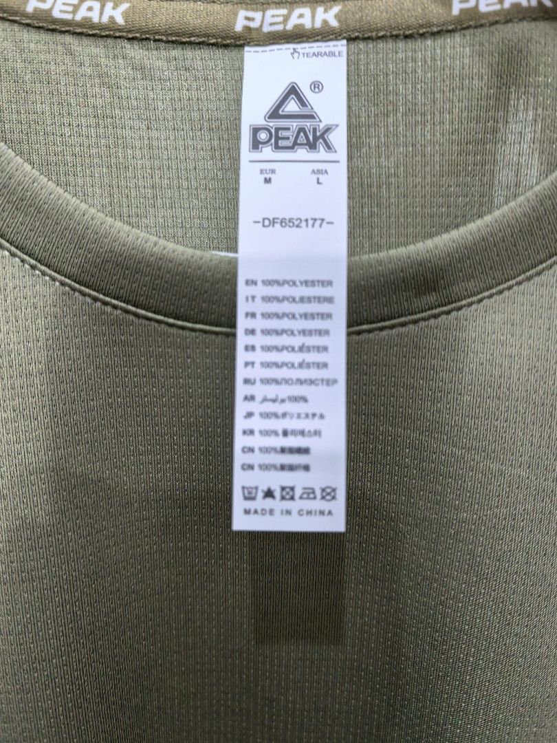 PEAK Olive Green Athletic T-Shirt (Category: Tshirts & Polo Shirts ) located in Manila. Submitted by kenslie (Listing ID 1447615657, Image 3). Description: - Olive green PEAK t-shirt - Short sleeves, crew neck - Made of 100% polyester - Ideal for sports or casual wear - Brand new with tags still attached.