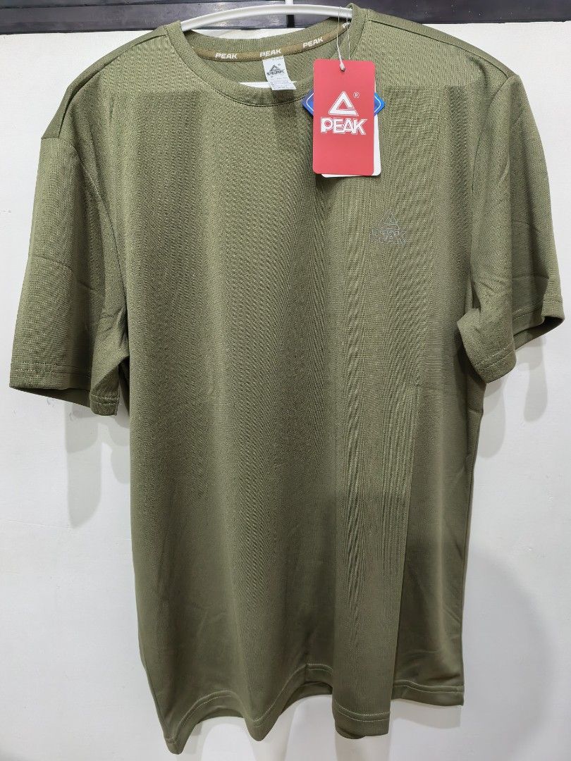 PEAK Olive Green Athletic T-Shirt (Category: Tshirts & Polo Shirts ) located in Manila. Submitted by kenslie (Listing ID 1447615657, Image 1). Description: - Olive green PEAK t-shirt - Short sleeves, crew neck - Made of 100% polyester - Ideal for sports or casual wear - Brand new with tags still attached.
