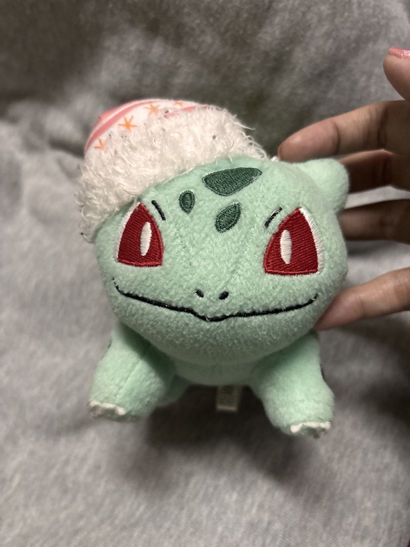 Pokemon Bulbasaur Plush Toy with Santa Hat (Category: Plushies & Soft Toys) located in Pasay City. Submitted by tindeclutterstuff (Listing ID 1447673050, Image 1). Description: - Adorable Bulbasaur plush toy - Comes with a festive Santa hat - Ideal for Pokemon enthusiasts - Perfect for Christmas decorations - Soft and cuddly material - Makes a wonderful holiday gift #bulbasaur #pokemon #pokemonplushie #pokemoncharms.