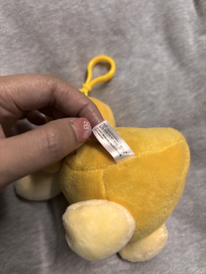 Pokemon Psyduck Plush Toy Keychain (Category: Plushies & Soft Toys) located in Pasay City. Submitted by tindeclutterstuff (Listing ID 1447673385, Image 2). Description: - Adorable Psyduck plush toy - Features a keychain attachment - Perfect for decorating bags or keys #psyduck #pokemon #pokemonplushie.